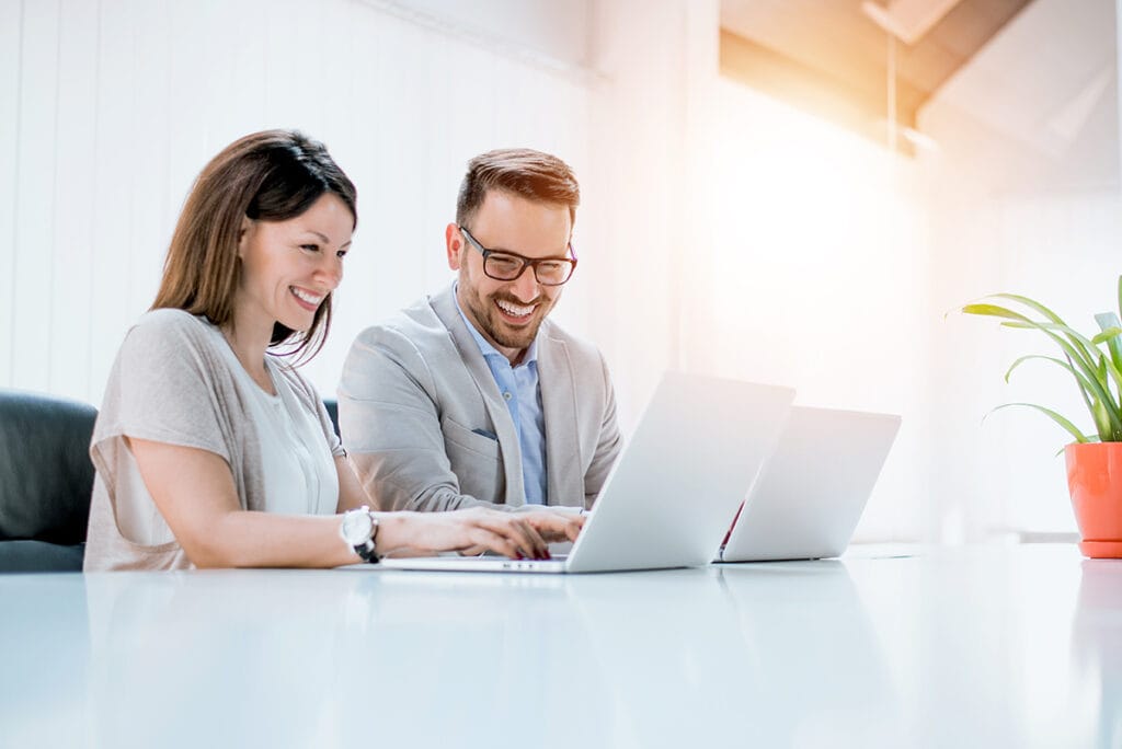 couple with laptops